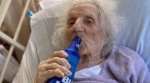 ‘Feisty’ 103-year-old woman celebrates with beer after beating COVID-19