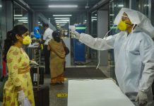 Medics screen passengers as they arrive at the NSCBI Airport to catch a flight for Guwahati, amid ongoing Covid-19 lockdown, in Kolkata, Thursday, May 28, 2020. | PTI